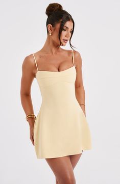 Keep it fun and flirty in the Dakota dress, everyone's fave mini of the season. Made in our lightweight stretch crepe, this figure-hugging design snatches in at the waist and flares into an A-line skirt. The neckline has a slight sweetheart shape with seam detail, while the straps are adjustable for your perfect fit.Ãƒâ€šÃ‚Â     Colour: Lemon.  Premium stretch crepe fabric.  Fully lined.  Slight sweetheart neckline.  Seam detail on bust.  Shaped underbust.  A-line shape skirt.  Adjustable straps