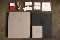 an assortment of stationery items displayed on a table top with business cards and envelopes