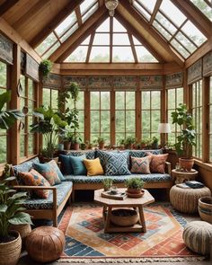 a living room filled with lots of furniture and plants on top of it's windows