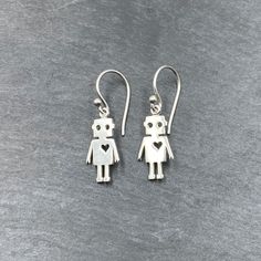 "Sterling silver cute Robot earrings make fun gifts for the nerds and geeks in your life. - Robot charms 6/8\" tall - All jewelry parts are 925 solid sterling silver Gift Box Included - Send direct! Short gift note may be added at checkout. Receipts not included. About Quality Quality and safety of sourced sterling silver materials are very important to me. I only source materials from reputable companies and countries. 🦋 Visit the shop for more cute jewelry! https://www.etsy.com/shop/TheZenMus Sterling Silver Dangle Earrings As A Gift, Hypoallergenic Dainty Sterling Silver Earrings, Dainty Hypoallergenic Sterling Silver Earrings, Sterling Silver Earrings With Lever Back As A Gift, Silver Earrings With Lever Back Ear Wires For Gifts, Dainty Sterling Silver Nickel-free Earrings, Robot Jewelry, Spaceship Earrings, Silver Steampunk Earrings