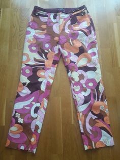 Cotton trousers with a beautiful print with a low waist Size s-m Retro Graphic Print Spring Bottoms, Retro Graphic Print Bottoms For Spring, Retro Spring Bottoms With Graphic Print, Cotton Floral Print Patterned Bottoms, Floral Print Cotton Bottoms, Patterned Floral Print Cotton Pants, Patterned Cotton Bottoms With Floral Print, Multicolor Graphic Print Pants For Spring, Floral Print Stretch Ankle-length Bottoms