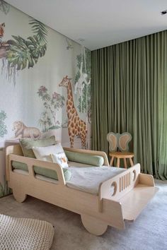 a child's bedroom with green curtains and giraffes on the wall