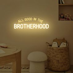 a neon sign that says, all good in the brotherhood on it's wall