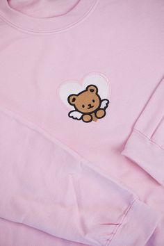 "Sweatshirt is Gildan Heavy Blend 50% Cotton/ 50% Polyester. Design is Embroidered. Design is 3.5\"H x 4\"W." Streetwear Long Sleeve Tops With Embroidered Patch, Cute Cotton Sweater With Embroidered Logo, Cute Embroidered Sweatshirt For Loungewear, Cute Embroidered Logo Sweatshirt For Streetwear, Cute Embroidered Crew Neck Hoodie, Cute Crew Neck Sweatshirt With Embroidered Logo, Cute Crew Neck Sweater With Embroidered Logo, Cute Crew Neck Sweatshirt With Heart Graphic, Cute Sweatshirt With Heart Graphic And Crew Neck