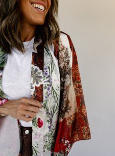 removable fabric belt long bell sleeves floral patchwork design side slits unlined no stretch 100% polyester hand wash cold Kat is 5’4” wearing size small small: 43" bust // 45.5" length medium: 45" bust // 46" length large: 47" bust // 46.5" length Spring Outerwear With Patchwork And Kimono Sleeves, Fitted Floral Kimono For Festival, One Size Multicolor Floral Print Outerwear, Multicolor Floral Print One-size Outerwear, Multicolor Floral Print Outerwear One Size, Oversized Floral Print Kimono For Fall, Summer Boho Print Long Sleeve Outerwear, Summer Long Sleeve Outerwear With Boho Print, Summer Long Sleeve Boho Print Outerwear