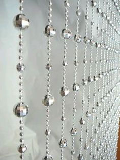 an image of some beads hanging on a wall with the caption saying, saved from event record com