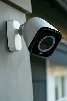 a security camera mounted on the side of a building