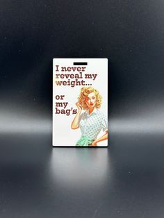 a magnet with the words i never reveal my weight or my bag? on it