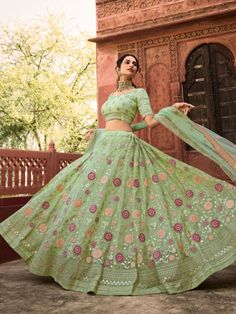 Buy graceful pista green organza wedding lehenga choli at affordable shopping price. This delectable lehenga choli which comes with organza blouse and net dupatta. Green Lehenga Choli, Wedding Lehenga Choli, Pista Green, Indian Lehenga Choli, Organza Lehenga, Organza Blouse, Green Lehenga, Organza Wedding, Lehenga Choli Online