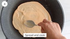 a pancake being cooked with a spoon in it and the words spread and cook below