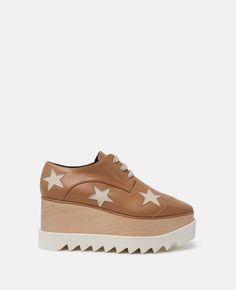 Discover Stella's Butterscotch Elyse Stars Platform Shoes today. Free standard shipping is available on all orders. Shop online now. Vegan Alternatives, Glitter Sandals, Vegan Bags, Bags Logo, Stella Mccartney Elyse, Sneaker Wedge, Flat Sneakers, Espadrilles Wedges, Online Bags