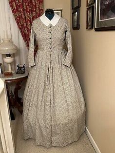 This dress is a size 16 and filts the lovely lady with Bust 38 and Waist 30. If we don't have the color / style or size you need, we do special orders! This dress is made from a period pattern - photo copies of the originals. Historical Long Sleeve Daywear Dress, Historical Long Sleeve Day Dress, Historical Design Long Sleeve Dress For Daywear, Historical Long Sleeve Dresses For Daywear, Historical Long-sleeve Day Dress, Long Sleeve Dresses With Historical Design For Daywear, Fitted Cotton Vintage Costume Dress, Victorian Cotton Dress With Historical Design, Fitted Cotton Vintage Dress For Costume