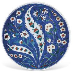 a blue and white plate with flowers on it