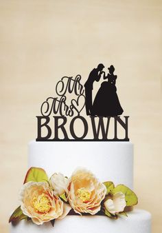 a wedding cake topper with the bride and groom on it