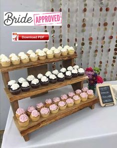 cupcakes are displayed on three tiered trays