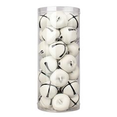 a glass container filled with white and black apples