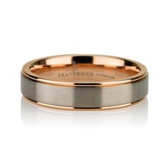 a men's wedding band with two tone gold inlays