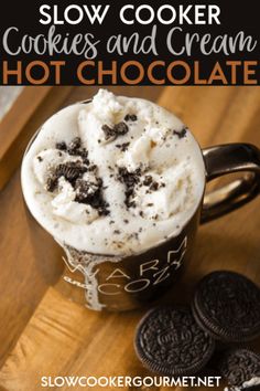 an ice cream in a mug with cookies on the side and text overlay reading slow cooker cookies and cream hot chocolate