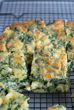 spinach and cheese quiche on a cooling rack