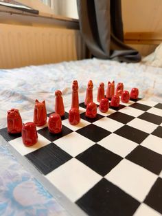 a chess board with red pieces on it