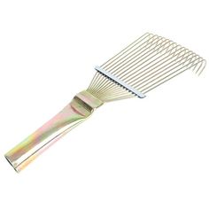 a metal comb that is on top of a white surface