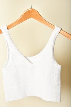 A jb and me fan favorite, these Nikibiki tanks are one-size, but are so stretchy and sturdy! You'll love pairing these tanks with any button up or tee, or wearing them alone! Oh- and they're reversible! Wear it forwards or backwards for a v-neck or a scoop neck, it's up to you! Brand: Nikibiki Content: 92% Nylon | 8% Spandex White Seamless V-neck Top, Everyday Ribbed V-neck Tank Top, Everyday V-neck Crop Top, V-neck Tops With Seamless Construction For Everyday, Stretch V-neck Crop Top For Everyday, Everyday Seamless V-neck Tops, Cotton V-neck Tank Top For Loungewear, Casual V-neck Tank Top With Seamless Construction, Everyday Seamless V-neck Tank Top