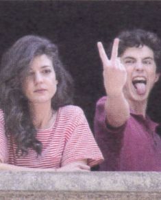 two people making the vulcan sign with their hands