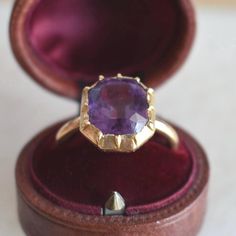 Antique ring from 1850 in 18-carat yellow gold. It features a step-cut amethyst with a deep violet hue, weighing approximately 7 carats (11 x 10 x 7 mm). This ring showcases a tubular-shaped band. Weight: 5.6 g Size: 53 FR (6.5 US - N UK) - Resizing included Metal: 18-carat Gold Stone: Amethyst Amethyst Weight: approx. 7 carats Guarantee Mark: Eagle's head (18-carat gold) Plateau: 13 x 12 mm Free Resizing & Free shipping Delivered with box & certificate You might also like: https://www.etsy.com/ Luxury Faceted Amethyst Ring For Formal Events, Luxury Faceted Amethyst Ring For Formal Occasions, Luxury Yellow Gold Amethyst Ring With Bezel Setting, Formal Yellow Gold Amethyst Ring With Bezel Setting, Luxury Purple Sapphire Wedding Ring, Formal Faceted Amethyst Ring Fine Jewelry, Classic Purple Sapphire Ring For Wedding, Classic Purple Sapphire Wedding Ring, Heirloom Style Purple Amethyst Ring With Bezel Setting