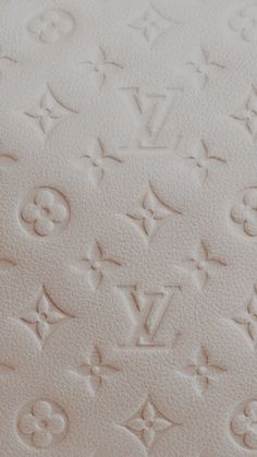 an upholstered mattress with monogrammed writing on it