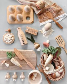 an assortment of kitchen utensils and wooden spoons