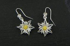 Yellow Earrings With Intricate Design For Gift, Ornate White Pierced Earrings, Ornate White Filigree Earrings, White Filigree Dangle Jewelry, Elegant Yellow Flower-shaped Earrings, Elegant Yellow Flower Shaped Earrings, Yellow Filigree Jewelry, Ornate White Sterling Silver Earrings, Yellow Filigree Jewelry Gift