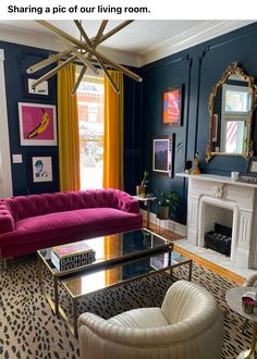 a living room filled with furniture and a fire place under a chandelier in front of a window