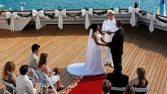 a couple getting married on the deck of a cruise ship