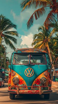 an old vw bus is parked on the side of the road with palm trees in the background