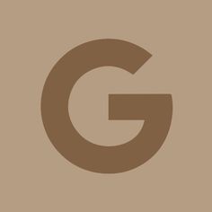 the letter g is made up of brown and black letters on a light brown background