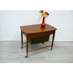 50s 60s sewing table / side table  on wheels from ilse möbel no. 3406 with a two-sided drawer and wool pull-out basket,  in walnut, mid century modern.  the drawer can be pulled out on both sides be, i.e. Right and left. In one  half are subdividing. The wool/fabric basket is pulled out to the front.  dimensions are: l 70 x w 44 x h 54 cm  condition: the sewing table has hardly any visible ones signs of use and is still in very good condition. This piece has an attribution mark,   i am sure that Table On Wheels, Applied Art, Fabric Basket, Table Side, Sewing Table, Fabric Baskets, Wool Fabric, Century Modern, Mid-century Modern