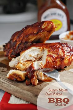 bbq chicken on a cutting board with barbecue sauce