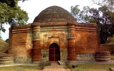 an old brick building with a large dome