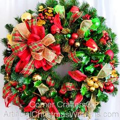 a christmas wreath with red, green and gold decorations