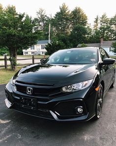 a black car parked in a parking lot