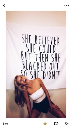 a woman posing in front of a white banner with the words she belived she could but then she blacked out so she didn't