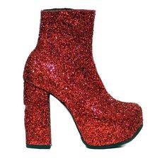 a pair of red glitter high heeled shoes on top of a white background,