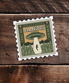 a stamp with an image of a mushroom on it and the words aliens printed on it