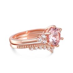 This exquisite ring set captures the essence of timeless elegance with its classic design. The main stone, a perfectly round morganite, takes center stage, radiating a soft and captivating blush hue. Flanking either side are three dazzling white gemstones, delicately set to enhance the brilliance of the centerpiece. The harmonious combination of the morganite and the sparkling white stones creates a mesmerizing display of light and color. Completing the set is a perfectly matched band, designed to complement the beauty of the main ring. Its intricate detailing and graceful curves add a touch of sophistication, enhancing the overall allure of this vintage-inspired masterpiece. With its nostalgic charm and impeccable craftsmanship, this morganite bridal set is a symbol of enduring love and t Elegant Morganite Diamond Ring With Prong Setting, Luxury Morganite Round Ring, Luxury Round Morganite Rings, Timeless Morganite Rose Gold Jewelry, Timeless Rose Gold Morganite Jewelry, Elegant Rose Gold Topaz Ring With Accent Stones, Classic Morganite Diamond Ring With Round Cut, Elegant Morganite Wedding Ring With Brilliant Cut, Morganite Pink Gold Rings With Accent Stones