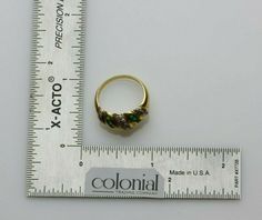 "Vintage 18K Yellow Gold Emerald and Diamond Domed Ring, diagonally set square green emeralds, round diamonds, prong set, 5/16\" across,internally numbered \"39348\", Ring size 6.5, Circa 1950, 4.27 grams Stock # BB188R10 Most rings are sizable for a small fee. If the ring you are considering is the incorrect size contact us for a quote. This listing contains photographs of the actual item you will receive. Our items are in excellent condition with little or no signs of wear and many are one of Classic Green Multi-stone Diamond Ring, Formal Green Diamond Ring With Prong Setting, Formal Green Rings With Diamond Accents, Green Rings With Diamond Accents For Formal Occasions, Antique Green Diamond Ring For Formal Occasions, Antique Green Diamond Ring With Prong Setting, Antique Green Diamond Ring, Antique Green Diamond Jewelry, Hallmarked Emerald Ring With Diamonds