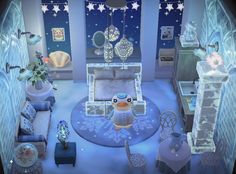 the room is decorated in blue and white with stars on the ceiling, furniture and decorations