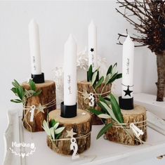 candles are tied with twine and placed on wood logs for decoration or centerpieces