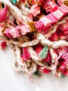 a pile of pink, white and green yarn