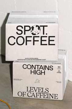 two boxes of coffee sitting on top of a floor next to each other with the words'levels of caffeine'printed on them