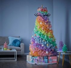 a brightly colored christmas tree in a living room